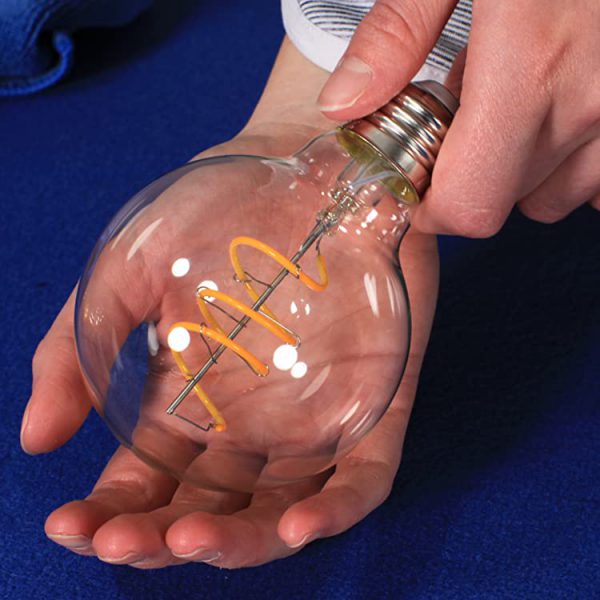 G25 NorbCOZY vintage edison bulb being held in hands